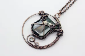 Circular Copper Wire Wrapped Pendant with Streaked Green and White Fused Glass