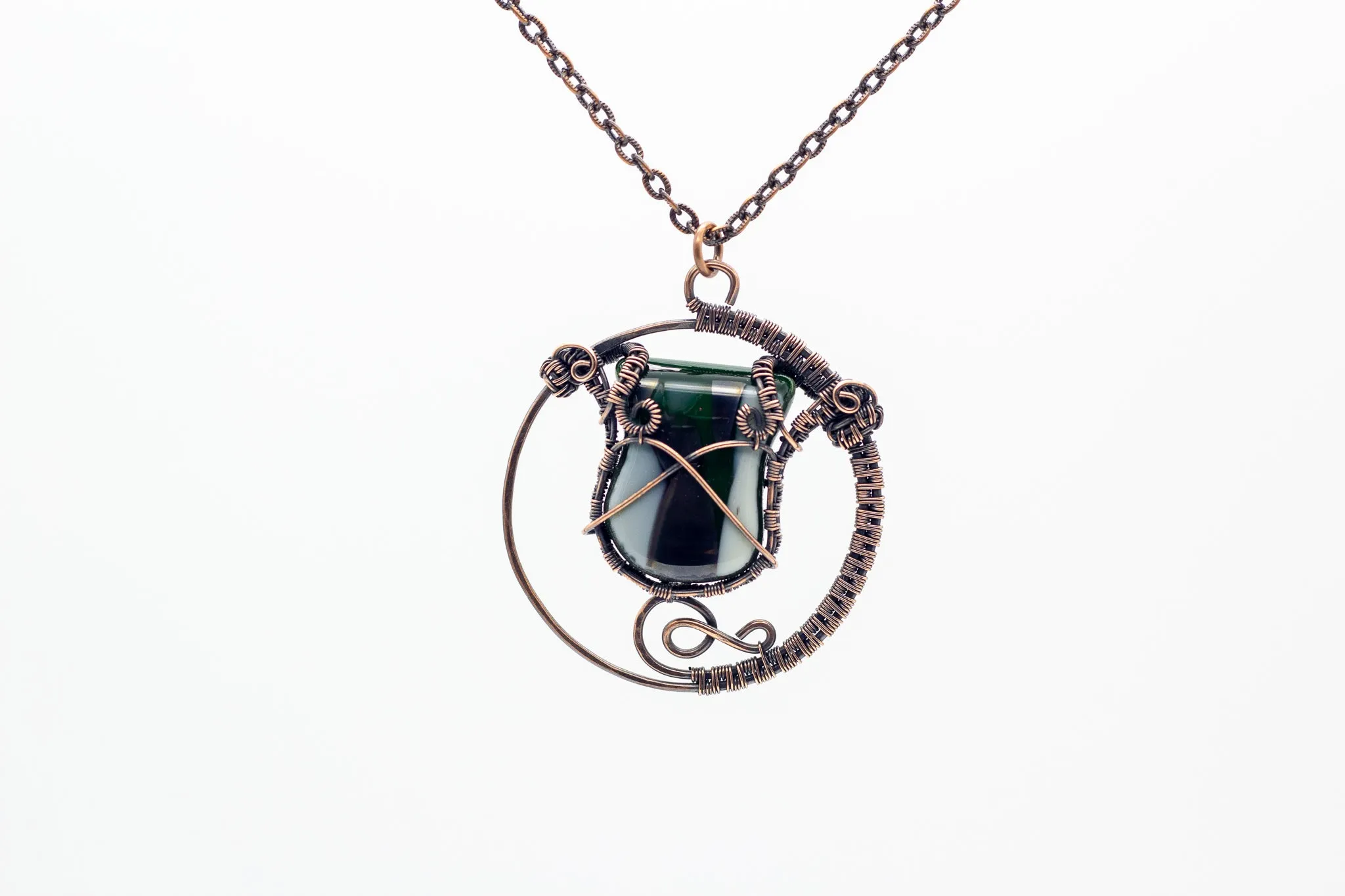 Circular Copper Wire Wrapped Pendant with Streaked Green and White Fused Glass