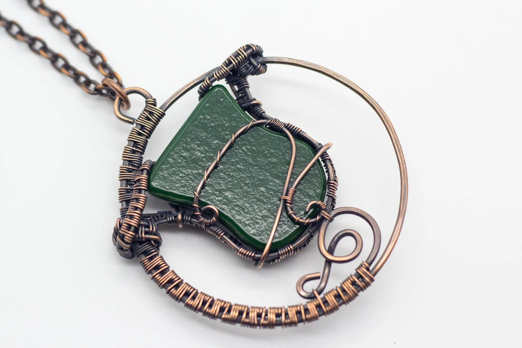 Circular Copper Wire Wrapped Pendant with Streaked Green and White Fused Glass