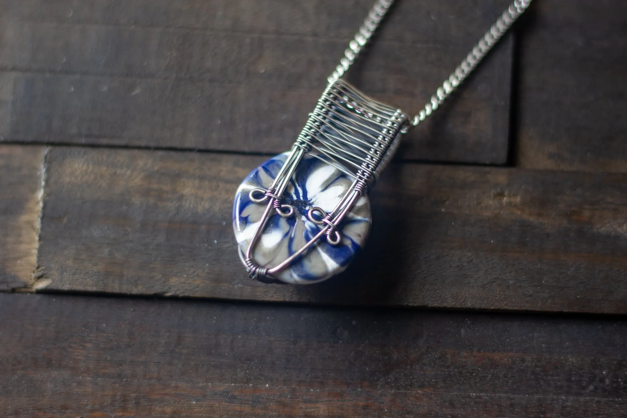 Silver, Blue, and White Crisscross Sterling Silver Wire Wrapped Pendant