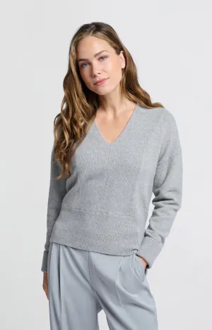 Soft sweater with deep V-neck and subtle rib details
