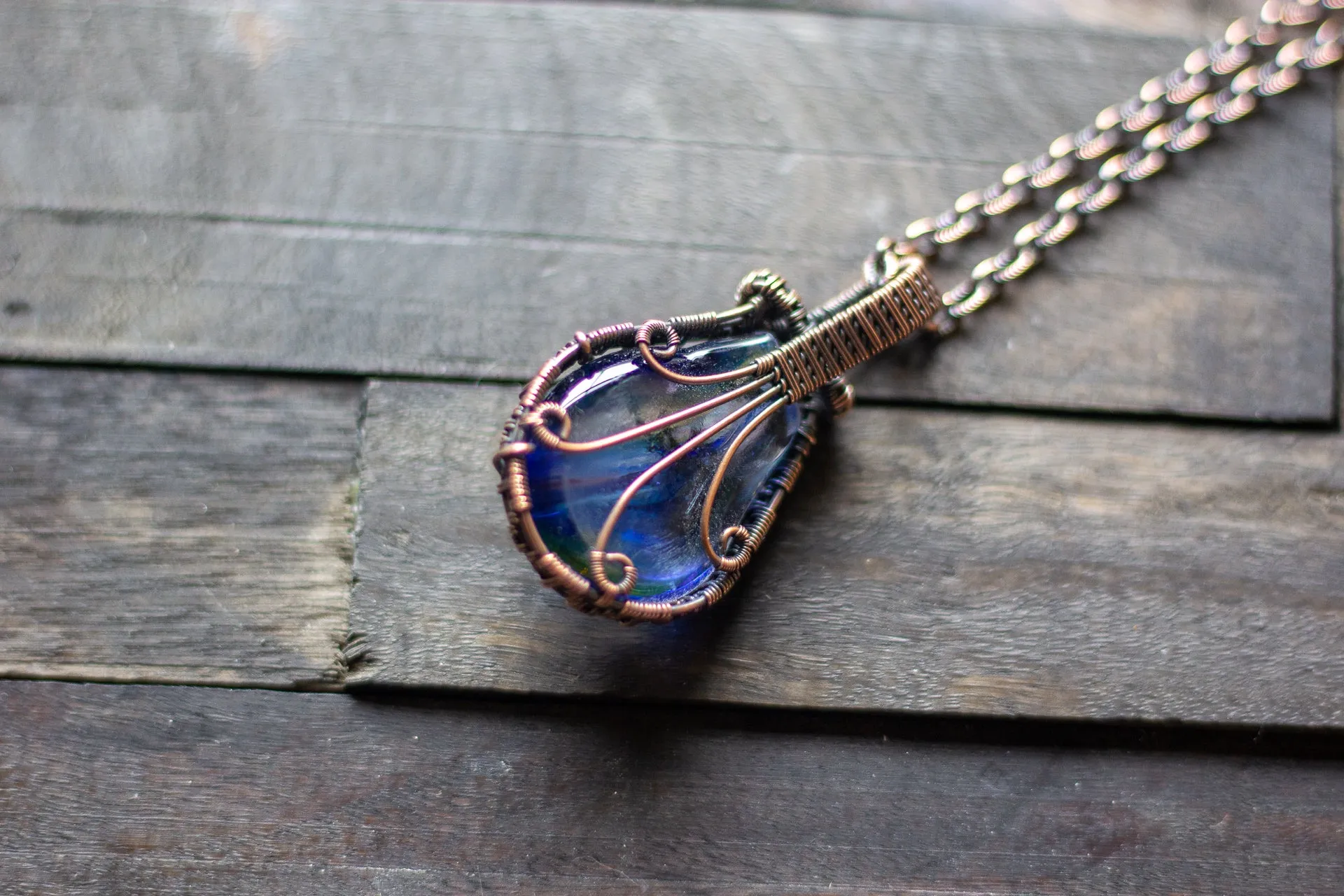 Transparent Streaked Blue Fused Glass Pendant with Copper Wire Wrapping